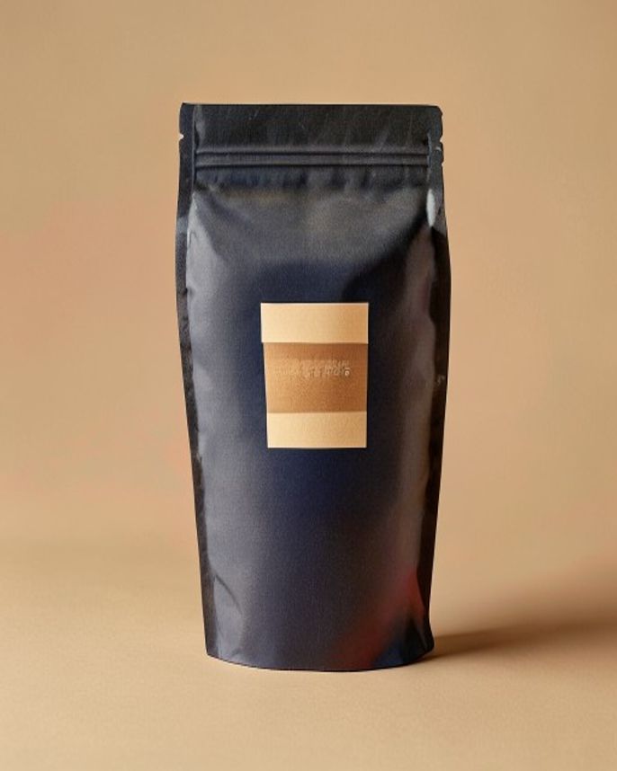 Matte indigo coffee bag with kraft label band